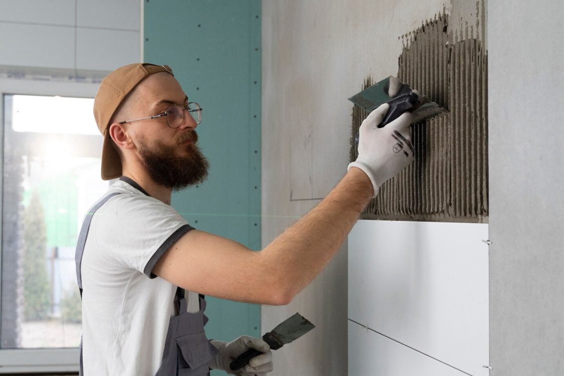 tiler-working-renovation-apartment_23-2149278613